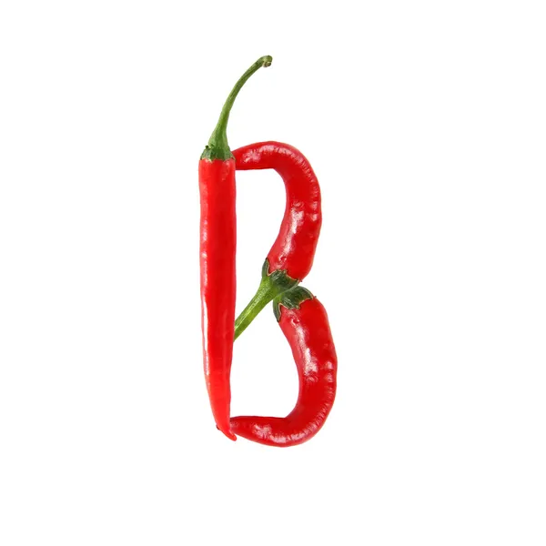 Obrázek slovo lásky, psaný s červeným chilli papričky — Stock fotografie