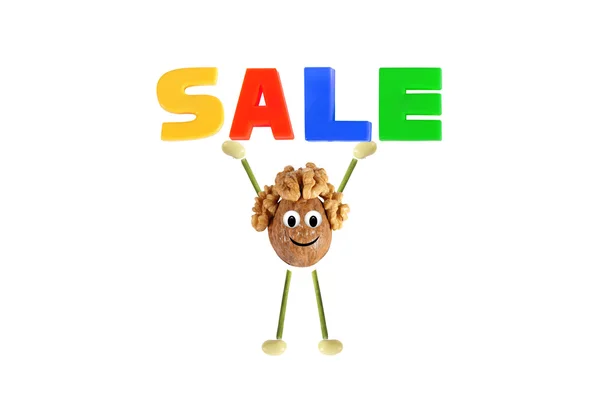 Healthy eating. Funny little man of the walnut lifting - sale — Stock Photo, Image