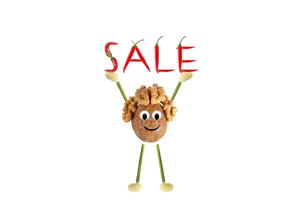 Healthy eating. Funny little man of the walnut lifting - sale — Stock Photo, Image