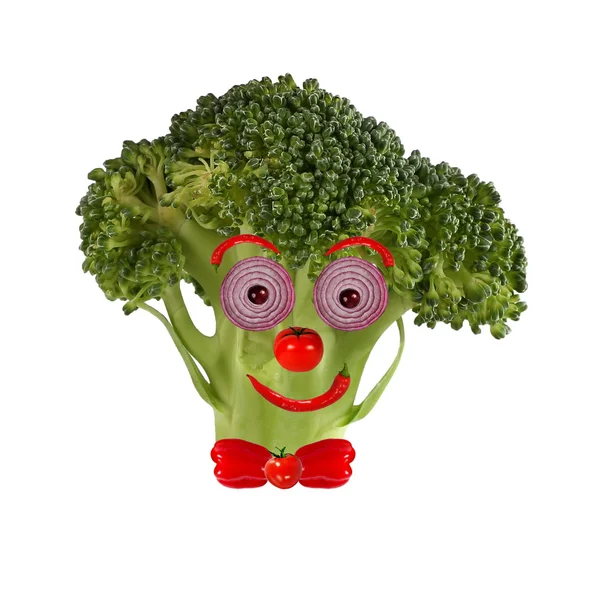 Sund mad. Sjovt ansigt lavet af grøntsager og frugter - Stock-foto