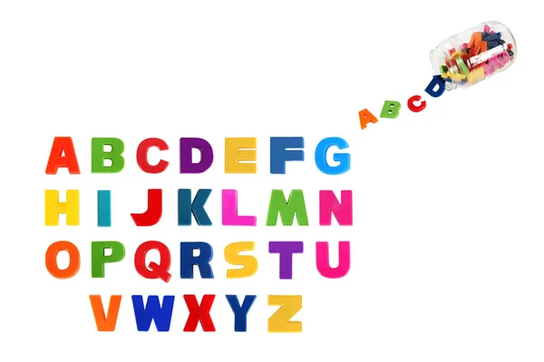 Alphabet written in multicolored plastic kids letters and colorf — Stock Photo, Image