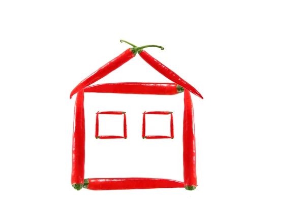 Healthy eating. House made of chili pepper. — Stock Photo, Image