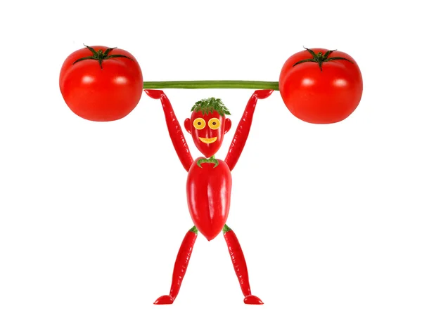 Healthy eating.Little funny man made ??of pepper  raises bar. — Stock Photo, Image