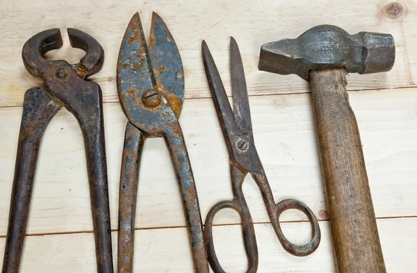 Hammer and nippers on wood background Stock Picture