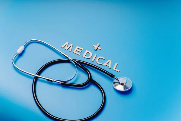 Healthcare and medicine concept.Medical science concept.Doctor table with medical items on blue background. Flat lay. — Stock Photo, Image