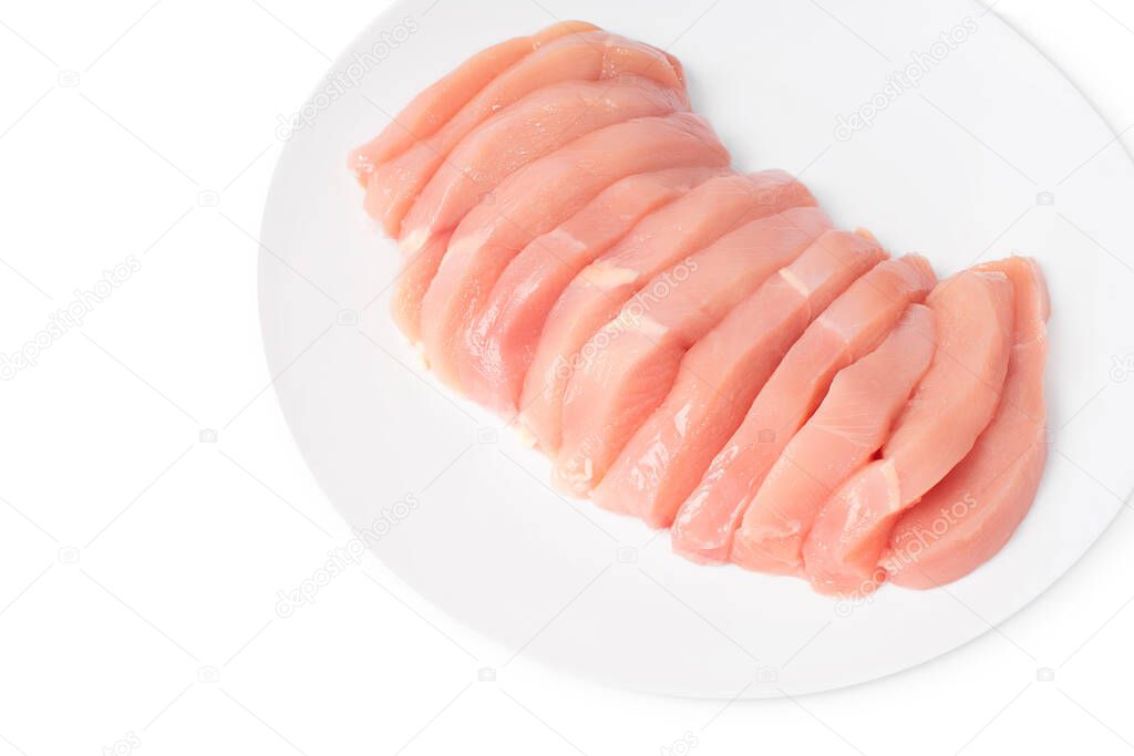 Fresh chicken legs close-up isolade.Top view of a four-piece raw whole chicken leg on a white plate on a white isolated background.