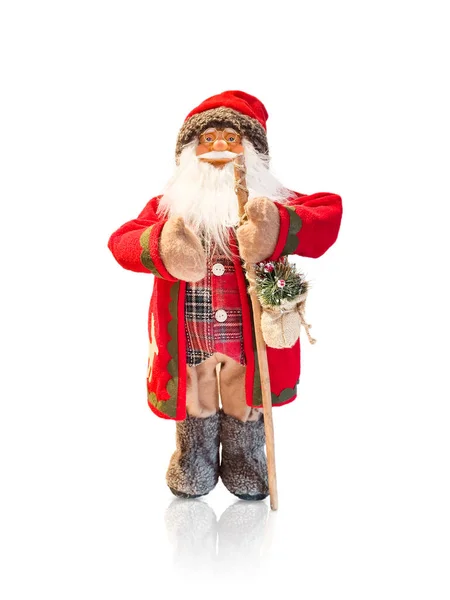 Doll figurine of Santa on an isolated background.Simple minimalistic Christmas home decor. Stock Photo
