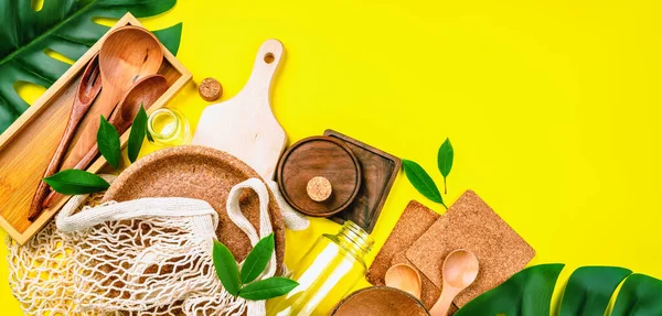 Ecological tableware made of natural materials.Life without Plastic.Eco friendly disposable tableware.Recycling concept.Set of empty reusable,disposable eco-friendly plates, on yellow background.