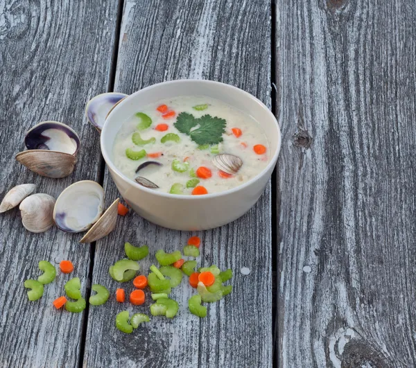 Clam chowder soup on old wood background — Stock Photo, Image