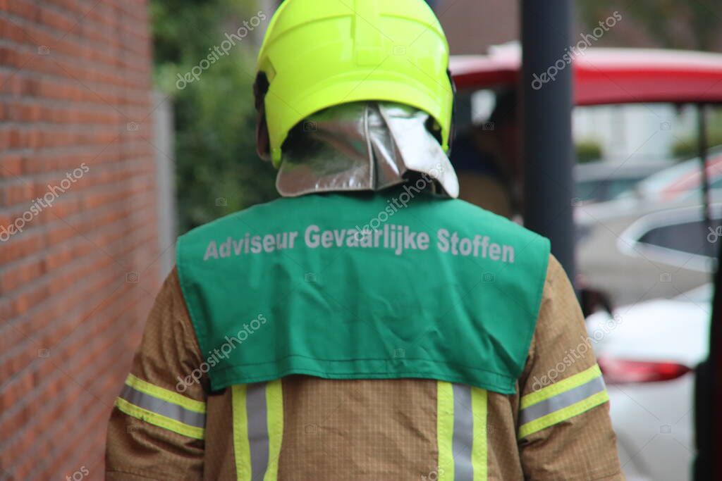 Fire department officer Advisor Hazerdous Substances (AGS) at fire in Rotterdam Nesselande in Netherlands