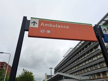 Direction road sign and barrier for the exit of ambulances at the Groene Hart hospital in Gouda in the Netherlands