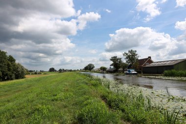Clouds above the north part of the Zuidplaspolder in Nieuwerkerk aan den IJssel along ringvaart at Kortenoord with extra clay to prevent flooding