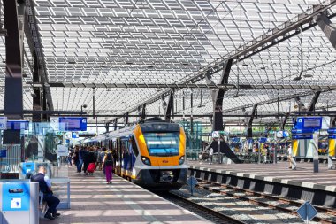 Caf Civity SNG local springer commuter train along platform of Rotterdam Central Station in the Netherlands