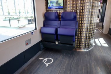 Presentation new INCG intercity with blue chairs in the second class with place for disabled people