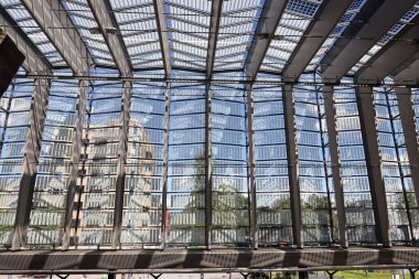 Walls and roof of glass of the modern Rotterdam Central Station in the Netherlands