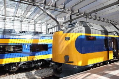 ICM and ICNG intercity train along platform at Rotterdam Central Station in the Netherlands