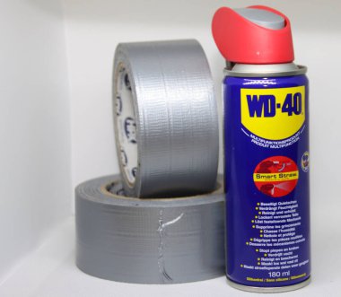 Roll of duct tape with a WD-40 lubricant aerosol as part of the tooling for workers