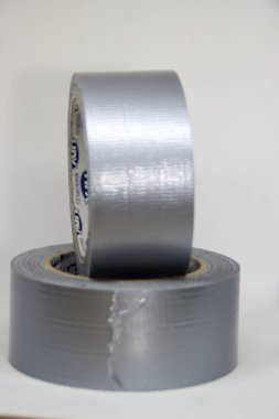Roll of duct tape with a WD-40 lubricant aerosol as part of the tooling for workers