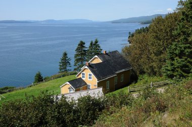 Quebec, old house in l Anse Blanchet in the Parc National du For clipart