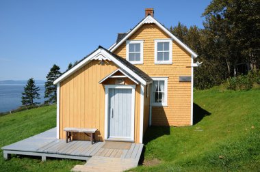 Quebec, old house in l Anse Blanchet in the Parc National du For clipart