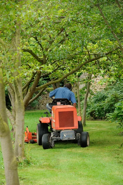 Lawn mower in a castle park — Stock Photo, Image