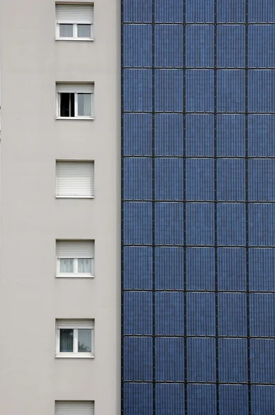 Photovoltaic panels on a wall of a building — Stock Photo, Image