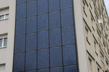 photovoltaic panels on a wall of a building clipart