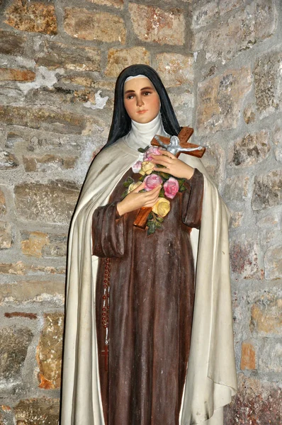 Staty av en nunna i loubressac kyrka — Stockfoto
