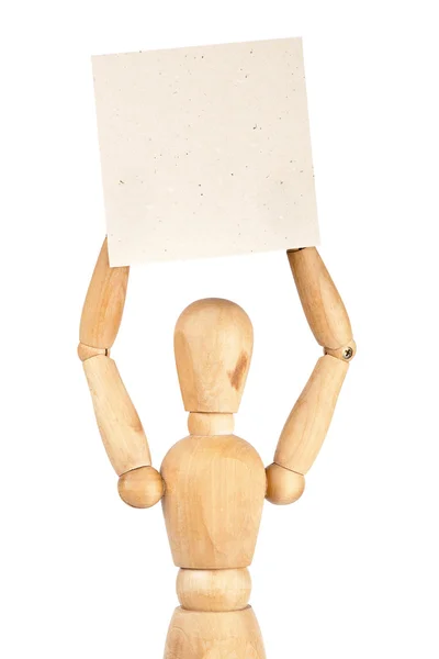 Wooden dummy holding paper — Stock Photo, Image