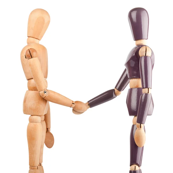 Wooden dummies shaking hands — Stock Photo, Image