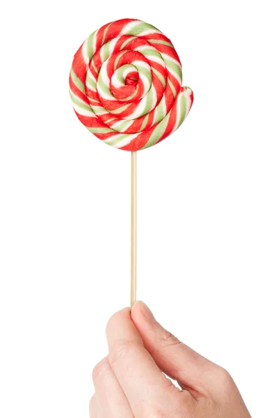 Hand holding colorful spiral lollipop — Stock Photo, Image