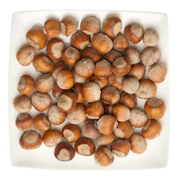 Deska lískových ořechů — Stock fotografie