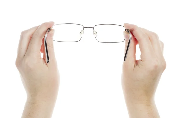 Mãos segurando óculos — Fotografia de Stock