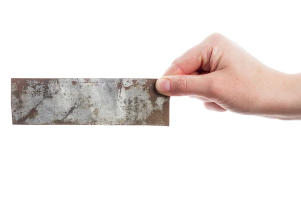 Hand holding old metal plate — Stock Photo, Image
