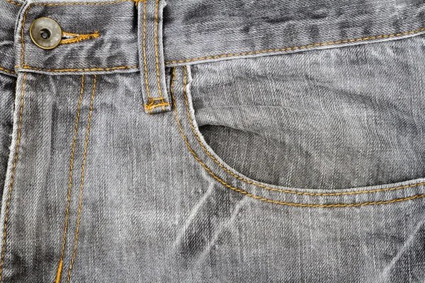 Tecido de jeans cinza com bolso — Fotografia de Stock