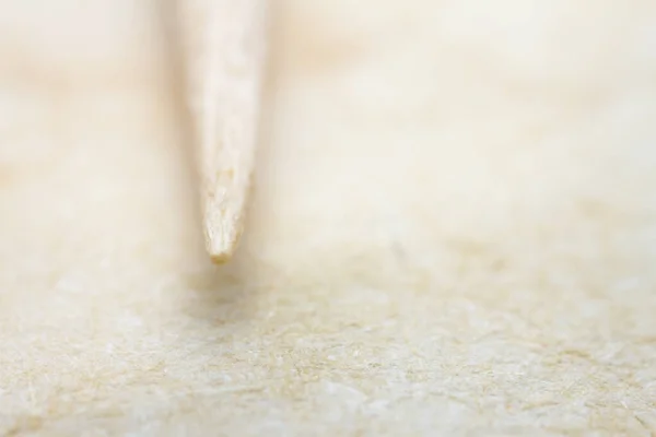 Extreme Close Van Beige Handgeschept Papier Met Een Tandenstoker Ondiepe — Stockfoto