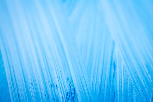 ブラシストロークを示す青のアクリル塗料のテクスチャの極端なクローズアップ 選択的焦点 — ストック写真
