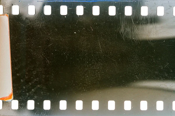 Dusty Grungy 35Mm Film Texture Surface Perforated Scratched Camera Film — Stock Photo, Image