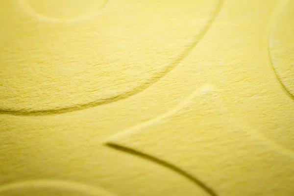 エンボス加工された黄色い紙の極端なマクロ 選択的焦点 フィールドの浅い深さ — ストック写真