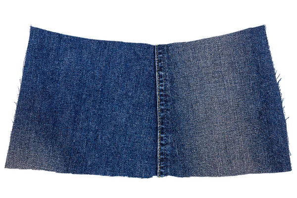 一块孤立的白色背景上的深蓝色牛仔裤织物 粗糙不平的边缘 — 图库照片