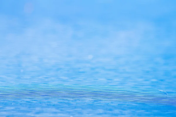 Macro shot of blue color vinyl record. Surface of an old vinyl record. Shallow deph of field.