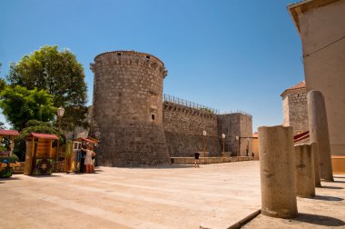 Square at Frankopan fortress and little shops at Krk - Croatia clipart