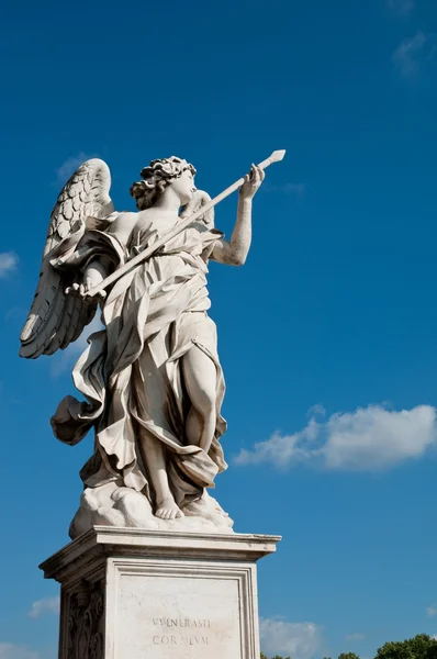 Statue at Sant Angello bridge on blue sky at Rome — Stock Photo, Image