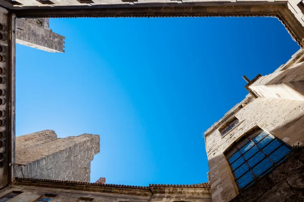 Palais des Archeveques watching up in courtyard at Narbonne in — Stock Photo, Image