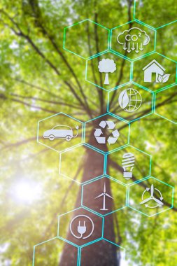 Gezegeni küresel ısınma ve iklim değişikliğinden korumanın sembolü. Yenilenebilir enerjiden çevreye geçiş yakıt tüketimini azaltır, sera etkisini azaltır, bitki ağaçları