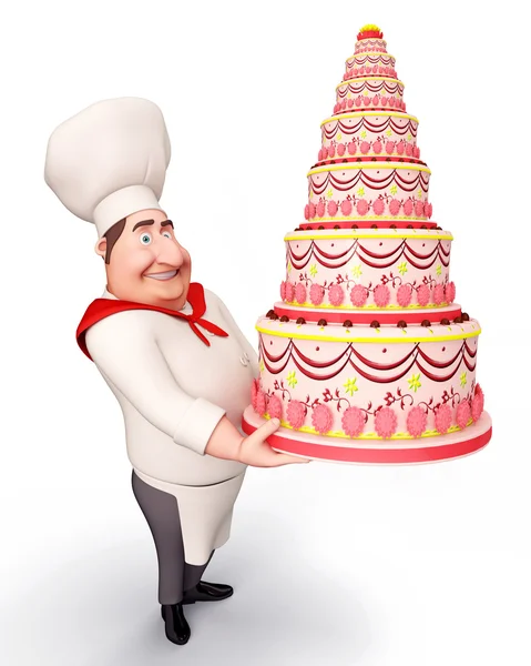 Chef decorando um grande bolo — Fotografia de Stock