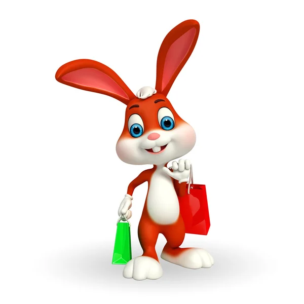 Conejo de Pascua con bolsas de compras —  Fotos de Stock