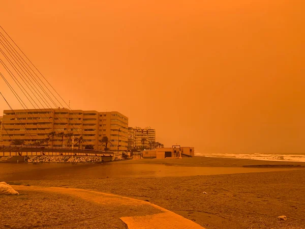 Orange day without filters. Sandstorm from the Sahara in Europe.