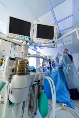 Emergency surgery modern technology. Monitoring of patient in surgical operating room in hospital.