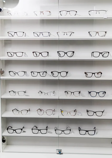 Stand of eyeglasses shop. Ophtalmology eye care glasses.